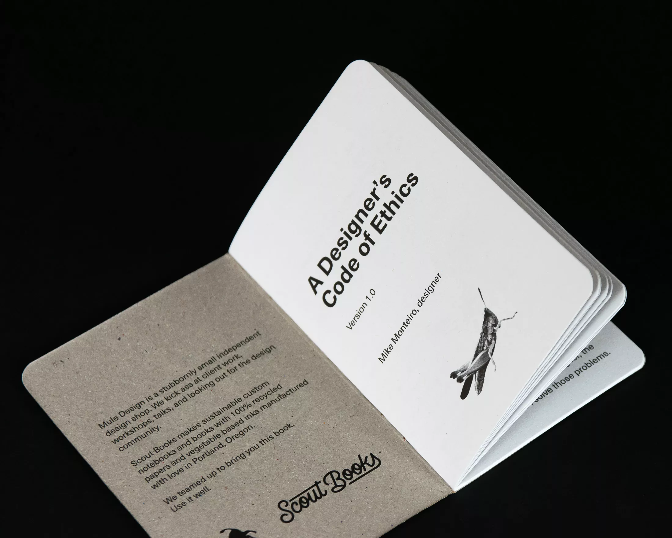 Open booklet displaying the cover of “A Designer’s Code of Ethics” by Mike Monteiro